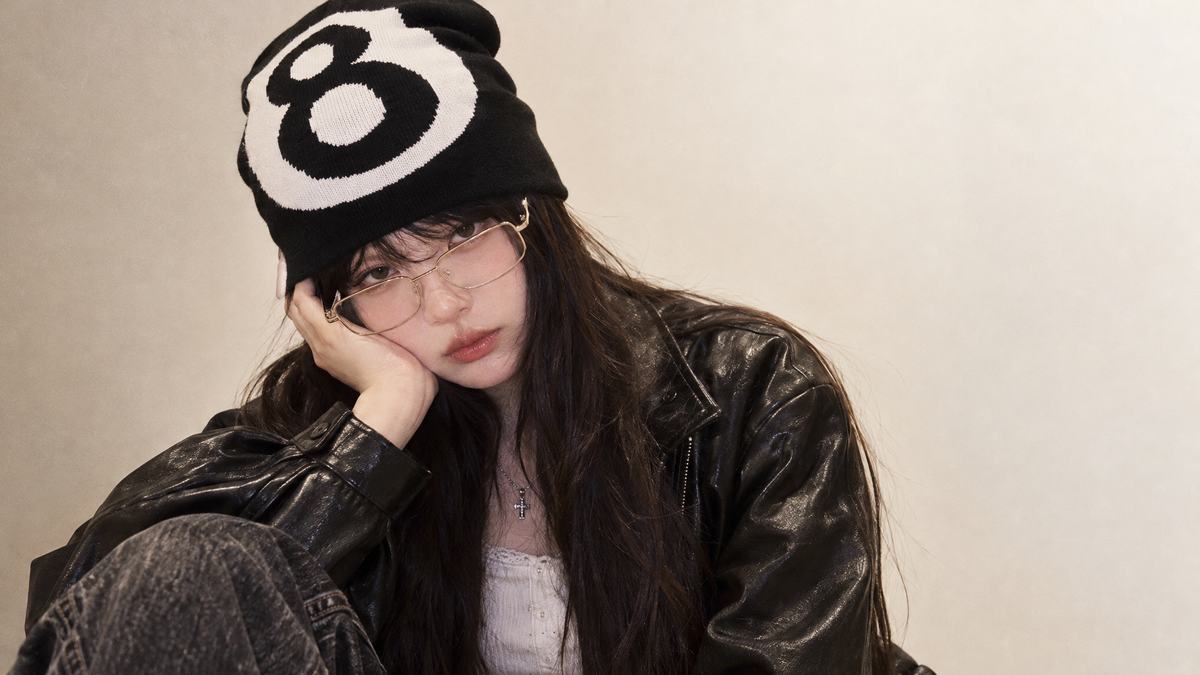 a fall winter vibe of a model wearing this beanie with a y2k outfit that matches @Number 8 Knitted Beanie (7 Color-ways Available)